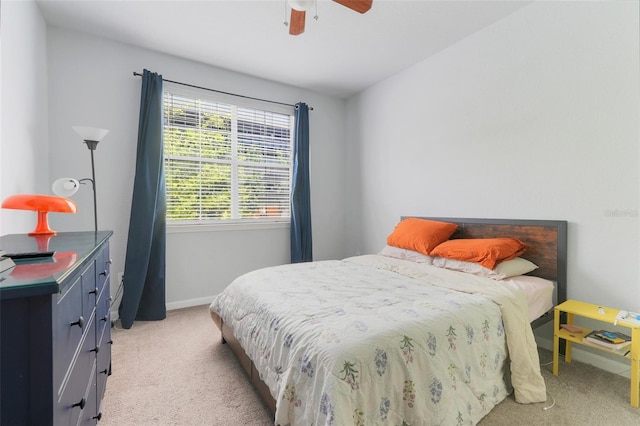 bedroom featuring carpet floors, baseboards, and ceiling fan
