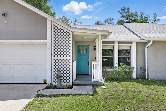 doorway to property featuring a garage, roof with shingles, stucco siding, and a lawn