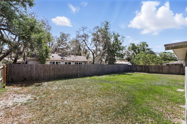 view of yard with a fenced backyard