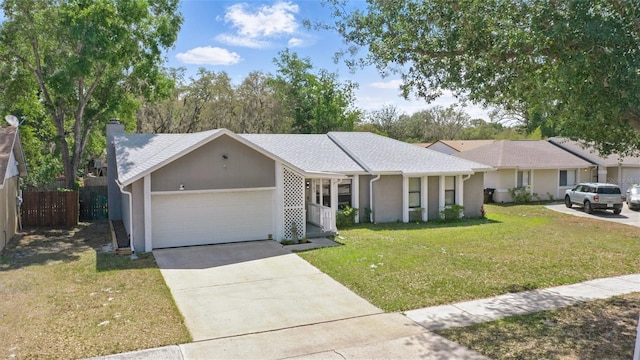 single story home with fence, a front lawn, concrete driveway, stucco siding, and a garage