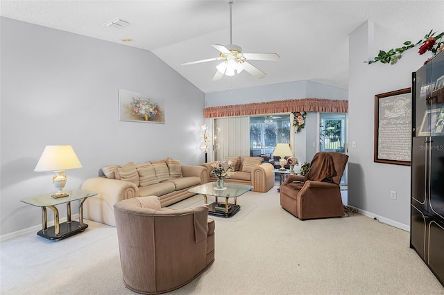 living area with baseboards, a ceiling fan, vaulted ceiling, and carpet floors