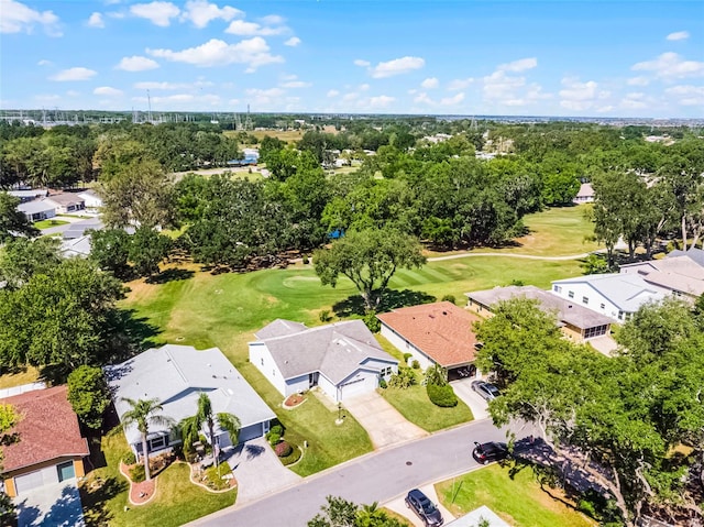 birds eye view of property featuring golf course view and a residential view