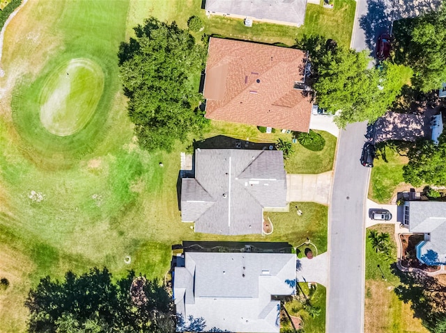 birds eye view of property with golf course view and a residential view