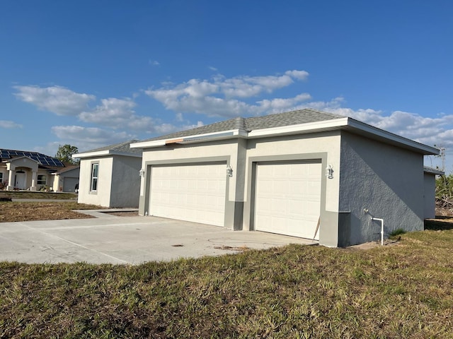 2310 Logsdon St, North Port, FL 34287 - garage featuring concrete driveway