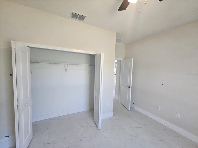 2310 Logsdon St, North Port, FL 34287 - unfurnished bedroom with a closet, baseboards, and a ceiling fan