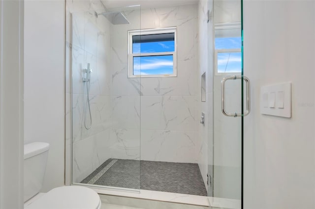 3024 Kensington Ave, Davenport, FL 33837 - bathroom with a marble finish shower and toilet