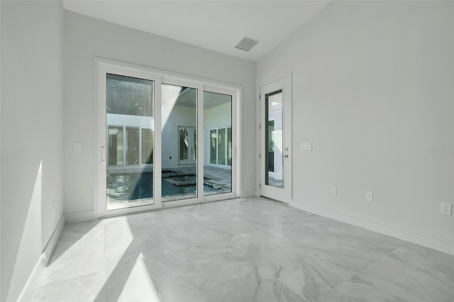 3024 Kensington Ave, Davenport, FL 33837 - empty room featuring marble finish floor, baseboards, and visible vents