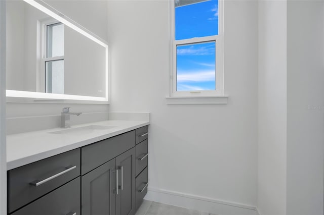 3024 Kensington Ave, Davenport, FL 33837 - bathroom featuring vanity and baseboards