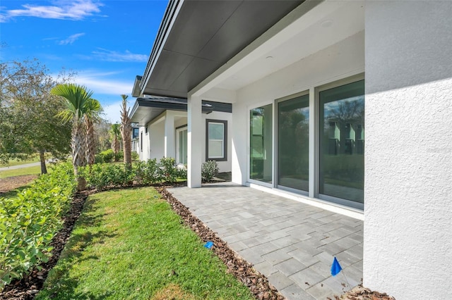 3024 Kensington Ave, Davenport, FL 33837 - exterior space featuring a patio and stucco siding
