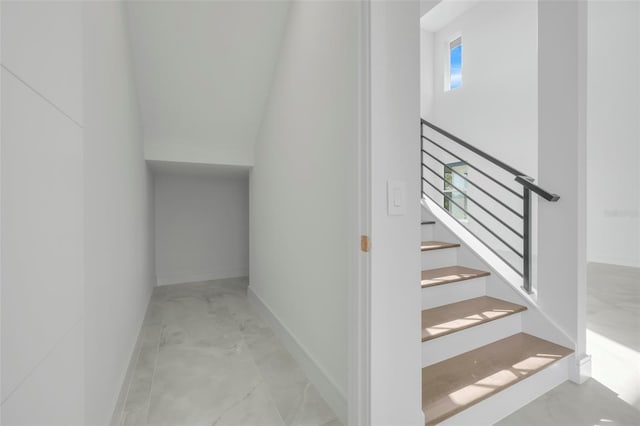 3024 Kensington Ave, Davenport, FL 33837 - staircase featuring marble finish floor and baseboards