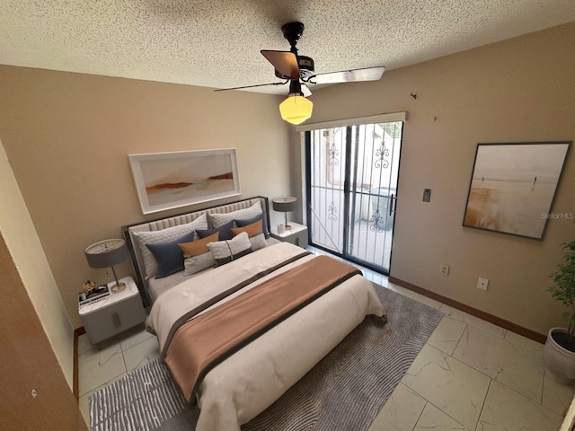 bedroom featuring marble finish floor, a textured ceiling, ceiling fan, and access to exterior
