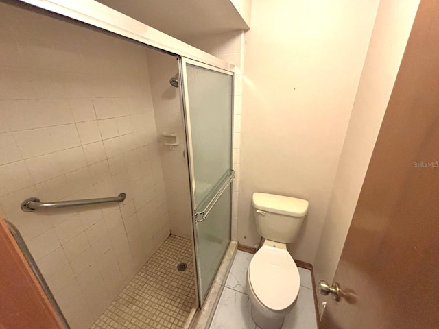 full bathroom with a shower stall, toilet, and tile patterned flooring