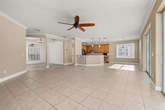 unfurnished living room with visible vents, ornamental molding, baseboards, a ceiling fan, and light tile patterned floors