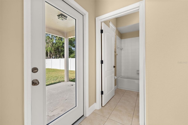 doorway featuring light tile patterned flooring
