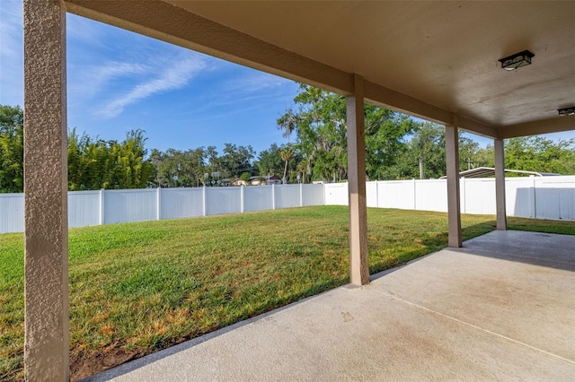 view of yard with a fenced backyard and a patio area