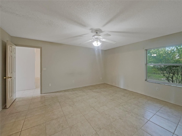 198 Bren Mar Ln, Palm Coast, FL 32137 - empty room featuring a textured ceiling, light tile patterned floors, and a ceiling fan