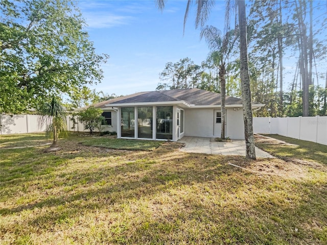 198 Bren Mar Ln, Palm Coast, FL 32137 - back of property with a patio, a yard, a fenced backyard, and stucco siding