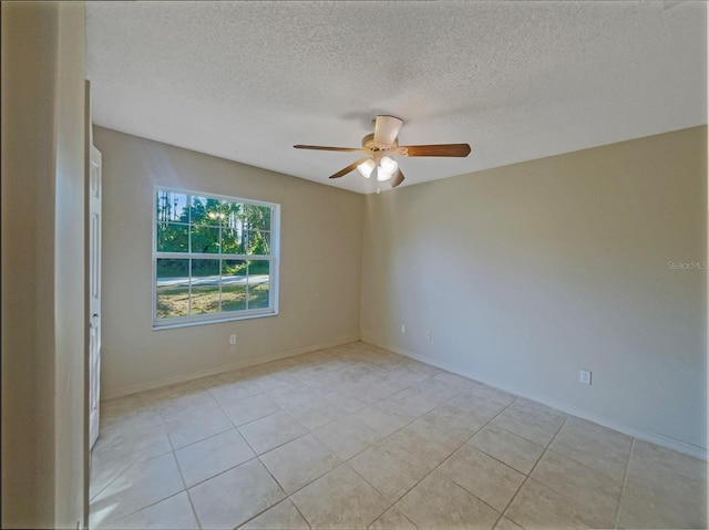 198 Bren Mar Ln, Palm Coast, FL 32137 - spare room with baseboards, a ceiling fan, light tile patterned flooring, and a textured ceiling
