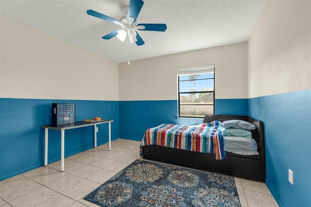 3205 Clewiston St, Deltona, FL 32738 - bedroom featuring a textured ceiling, ceiling fan, baseboards, and tile patterned floors