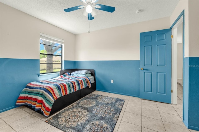 3205 Clewiston St, Deltona, FL 32738 - tiled bedroom featuring a textured ceiling and ceiling fan