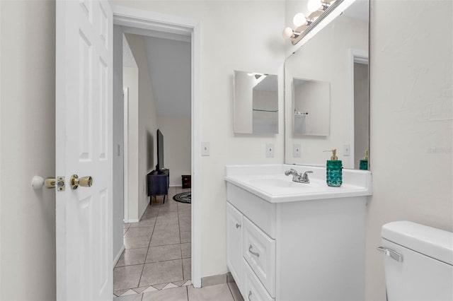 3205 Clewiston St, Deltona, FL 32738 - bathroom featuring tile patterned floors, vanity, and toilet