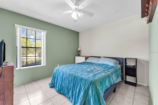 3205 Clewiston St, Deltona, FL 32738 - tiled bedroom featuring a textured ceiling and a ceiling fan
