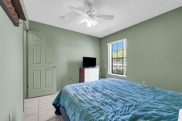 3205 Clewiston St, Deltona, FL 32738 - bedroom featuring light tile patterned floors, a textured ceiling, and ceiling fan