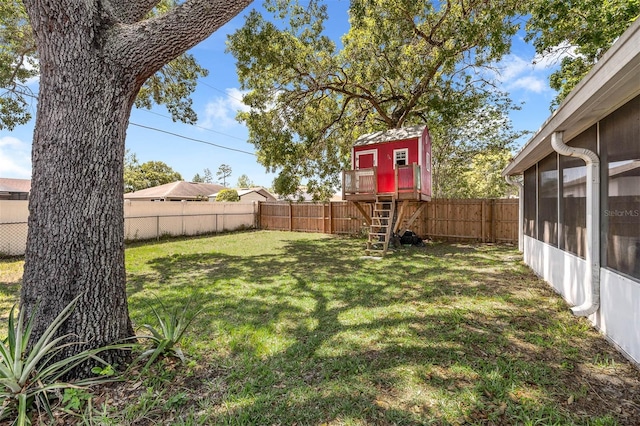 3205 Clewiston St, Deltona, FL 32738 - view of yard with a sunroom and a fenced backyard