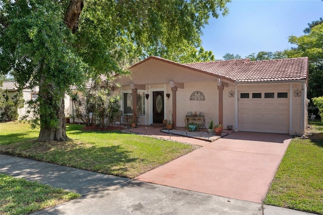 mediterranean / spanish-style house featuring a garage, a front yard, stucco siding, a tiled roof, and concrete driveway