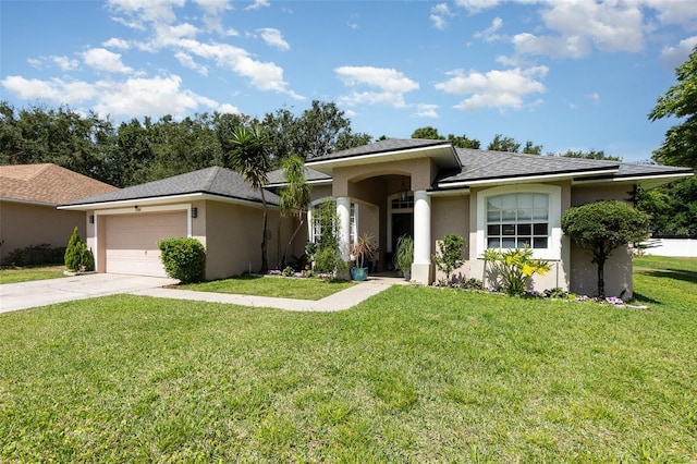 11506 Clair Pl, Clermont, FL 34711 - view of front of home with stucco siding, a front yard, driveway, and an attached garage
