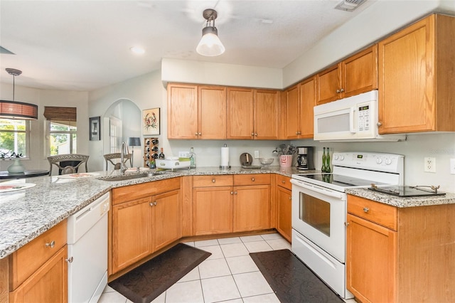 11506 Clair Pl, Clermont, FL 34711 - kitchen with light stone countertops, arched walkways, white appliances, hanging light fixtures, and a sink