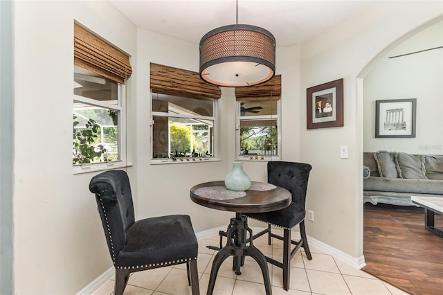 11506 Clair Pl, Clermont, FL 34711 - dining space with a wealth of natural light, baseboards, tile patterned flooring, and arched walkways