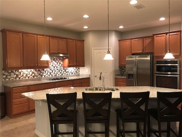14841 Porter Rd, Winter Garden, FL 34787 - kitchen featuring tasteful backsplash, recessed lighting, appliances with stainless steel finishes, under cabinet range hood, and a sink