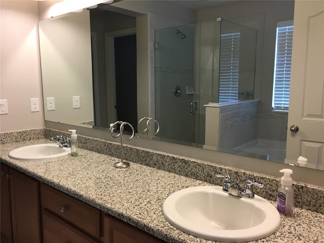 14841 Porter Rd, Winter Garden, FL 34787 - full bath featuring a shower stall, double vanity, and a sink
