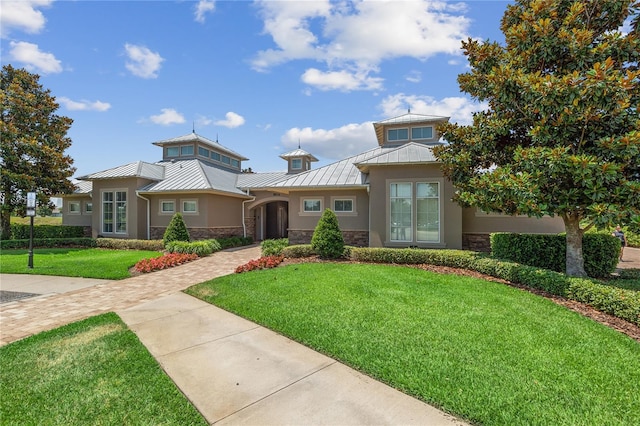 14841 Porter Rd, Winter Garden, FL 34787 - view of front of house with a standing seam roof, metal roof, and stone siding