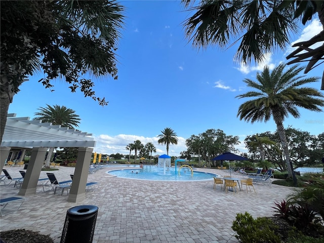 14841 Porter Rd, Winter Garden, FL 34787 - community pool with a patio and a pergola