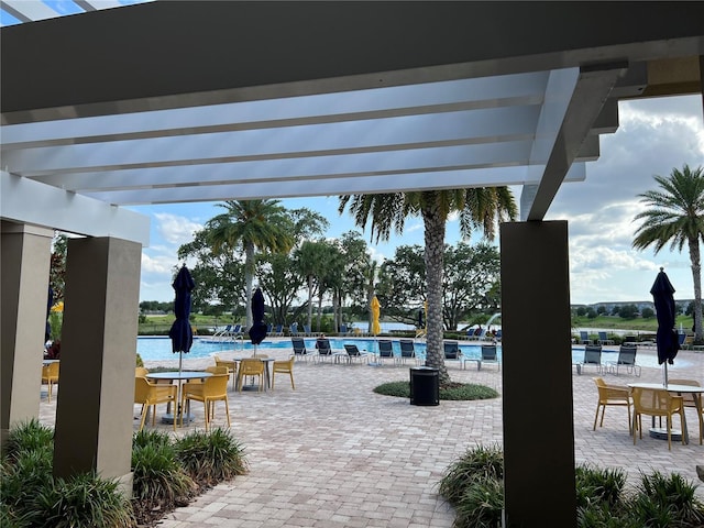 14841 Porter Rd, Winter Garden, FL 34787 - view of patio with a community pool and a pergola