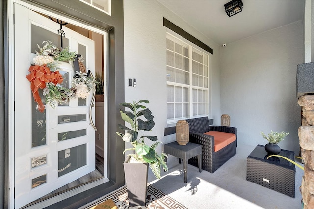 doorway to property with stucco siding