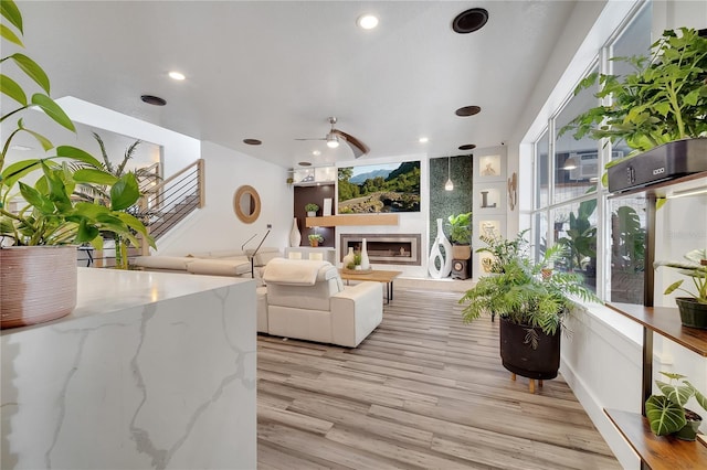 interior space featuring an outdoor living space and ceiling fan