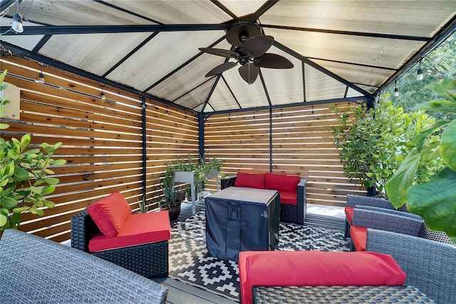 view of patio / terrace featuring an outdoor hangout area, a ceiling fan, and a gazebo