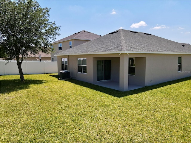 3702 Maidencain St, Clermont, FL 34714 - back of property featuring stucco siding, cooling unit, a patio area, fence, and a lawn