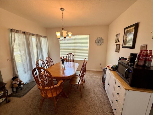 3702 Maidencain St, Clermont, FL 34714 - dining area with a chandelier and carpet floors