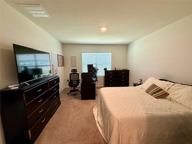 3702 Maidencain St, Clermont, FL 34714 - bedroom with light carpet, visible vents, and a textured ceiling