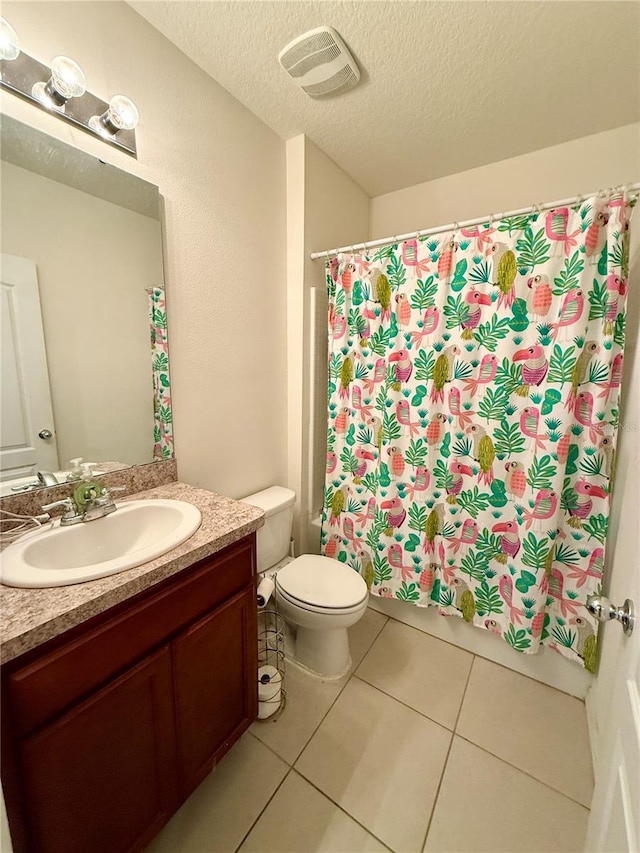 3702 Maidencain St, Clermont, FL 34714 - full bathroom with vanity, tile patterned flooring, a textured ceiling, toilet, and visible vents