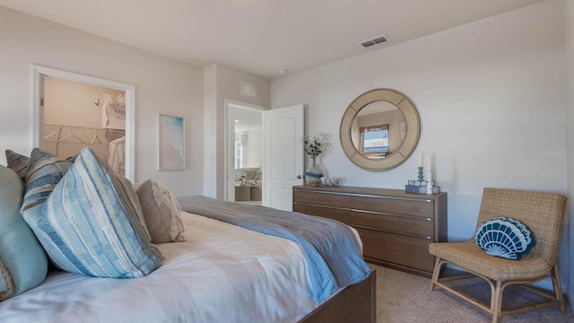 carpeted bedroom with a spacious closet and visible vents