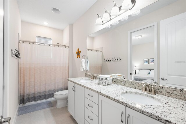 416 Southfield St, Kissimmee, FL 34747 - full bath featuring toilet, double vanity, a sink, and ensuite bath