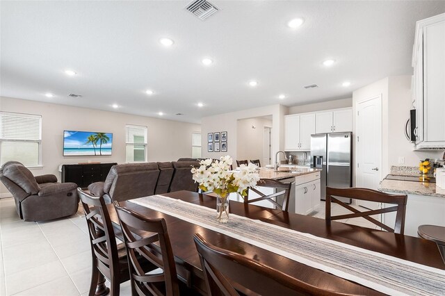 416 Southfield St, Kissimmee, FL 34747 - dining room featuring light tile patterned flooring, visible vents, and recessed lighting