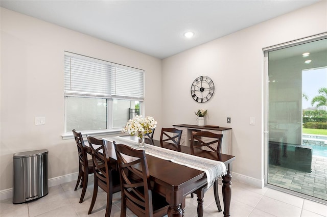 416 Southfield St, Kissimmee, FL 34747 - dining area featuring light tile patterned floors, baseboards, and plenty of natural light