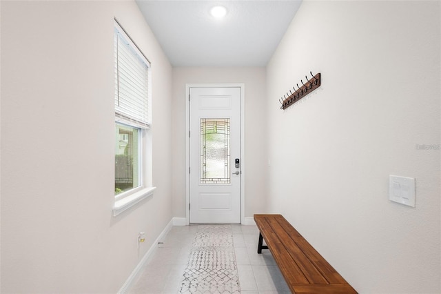 416 Southfield St, Kissimmee, FL 34747 - doorway to outside featuring light tile patterned floors and baseboards