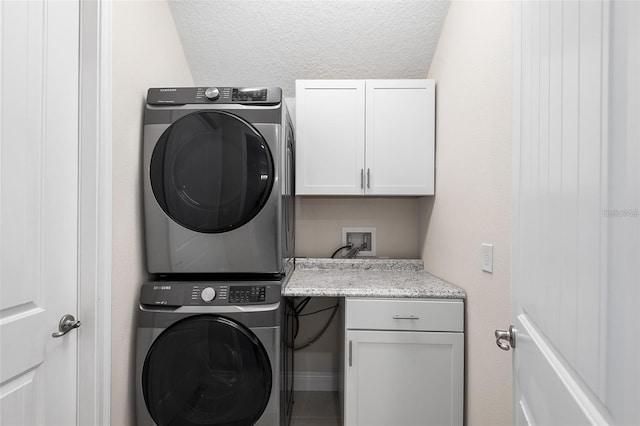 416 Southfield St, Kissimmee, FL 34747 - washroom featuring cabinet space and stacked washer and clothes dryer